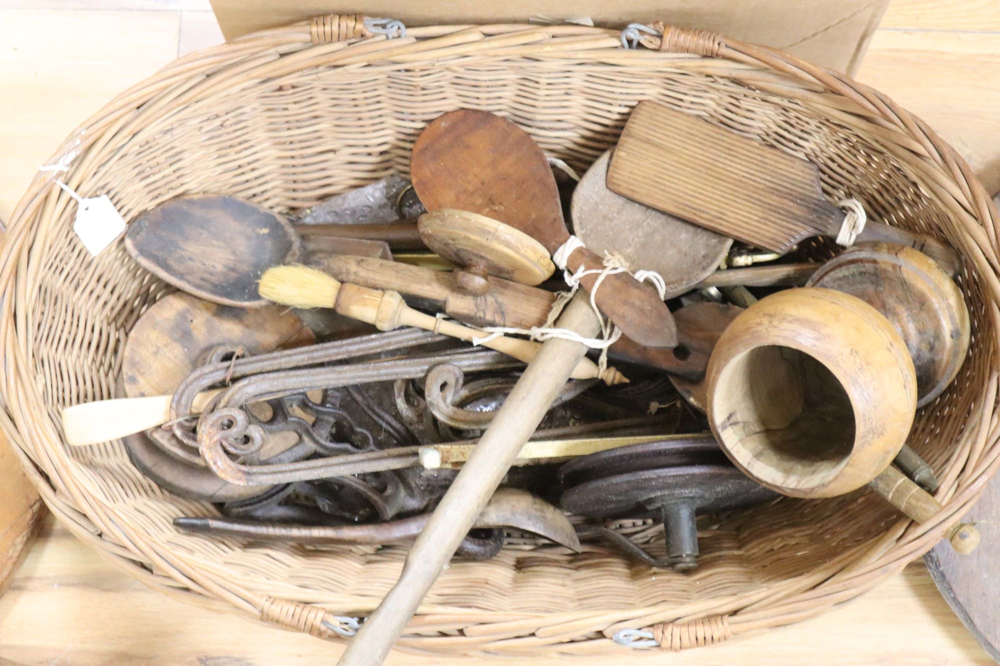 A large quantity of 19th/20th century treen, including an elm candlebox, bread boards, a child's chair, spoons etc.